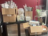 many boxes and containers on a table in a room