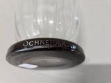 a close up of a wine glass on a table