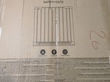 a box of safe snap safety gate sitting on a table