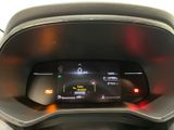 the dashboard of a car with a digital display in the center
