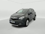 a grey car is parked in a white room with a white floor