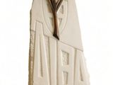 a white sculpture with a star on top of it
