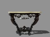 an antique console table with a marble top and carved legs
