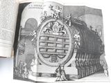 an open book with a drawing of a giant clock
