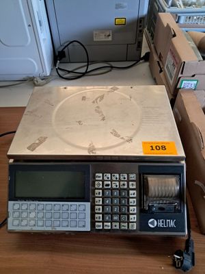 a calculator sitting on top of a table next to boxes