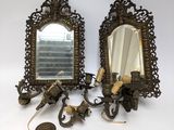 pair of antique brass wall sconces with mirrors and candle holders