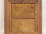an old wooden picture frame with a drawer underneath it on a white surface