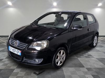 a picture of a small black car parked in a garage