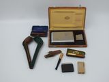 a box with a lighter, lighter and other items in it