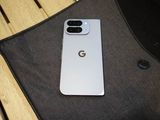 a white google pixel phone sitting on top of a wooden table