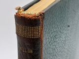 a close up of a book with a bookmark sticking out of it ' s cover