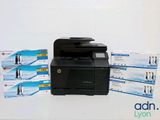 a printer sitting on top of a table next to a box of tissues