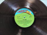 a record with a label on it sitting on a table
