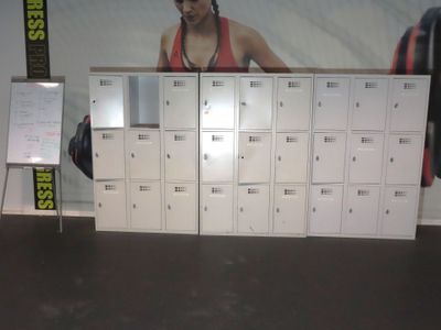 a wall of lockers with a picture of a woman on it