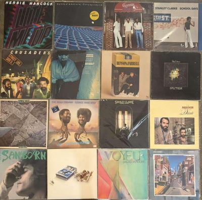 a lot of records on the floor of this room
