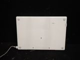 a white laptop computer sitting on top of a black table