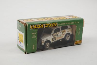 a box with a toy truck in it on a white surface