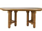 a wooden table with four legs and a round top