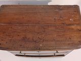 a small wooden table with a drawer underneath it