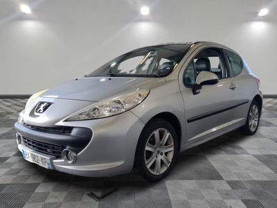 the small silver car is parked in a large room