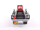 a toy truck that is sitting on a white surface