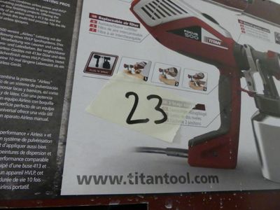 a picture of a picture of a red and black electric hand held nail dryer