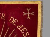 a red and gold banner with a cross on it