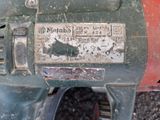 a close up of a motor with a sign on it