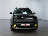 a black car that is parked in a white room