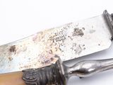 a knife that is sitting on top of a knife holder
