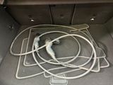 a car trunk with a bunch of hoses in it