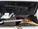a guitar that is in a case on a table