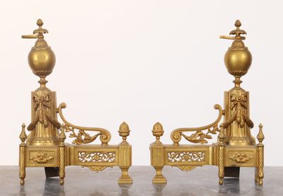 two golden statues sitting on top of a table
