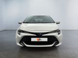 the front of a white toyota corollant parked in a white room