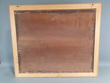 an old picture of a wooden frame with a red apple in the corner