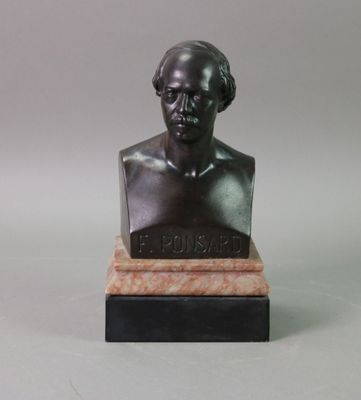 statue of a bust of a man sitting on a marble base