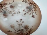 a picture of a decorative plate with flowers and birds on it