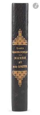 a close up of a black book with gold lettering on it