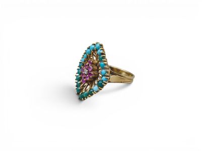 a gold ring with turquoise and pink stones