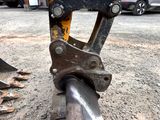 a close up of a piece of metal on the ground