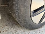 a close up of a car tire on the street