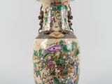 an image of a vase with flowers and birds painted on it