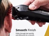 a man that is cutting his hair with a hair clipper