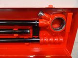a red tool box with a couple of tools inside of it