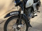 a black and white motorcycle parked on the side of the street