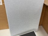 a laptop sitting on a table in front of some boxes
