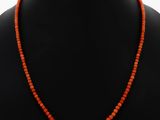 an orange beaded necklace on a mannequin mannequin mannequin mannequin mannequin mannequin mannequin mannequin mann
