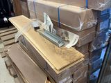 a stack of boxes and boxes on a pallet in a warehouse