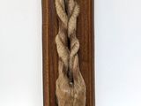 a picture of a wooden plaque with a bear ' s head on it
