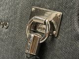 a close up of a purse with a lock on it